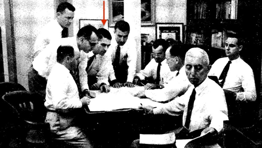 Admiral Hyman G. Rickover and some of his senior staff in the summer of 1958. Standing at rear: Willis C. Barnes; from left to right around the table: Robert Panoff, Howard K. Marks, Milton Shaw, I. Harry Mandil, Jack C. Grigg, James M. Dunford, and David T. Leighton. Photo by Paul Schutzer, Life magazine.